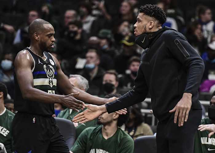 Milwaukee Bucks forward Giannis Antetokounmpo (right) reacts with forward Khris Middleton (22)